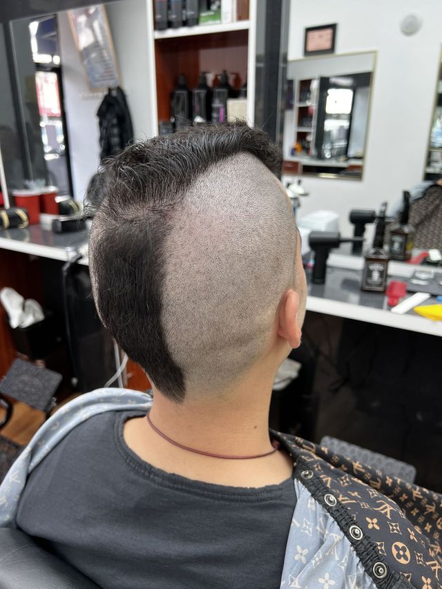 Detailed undercut design, done at Efraim's Barber Shop